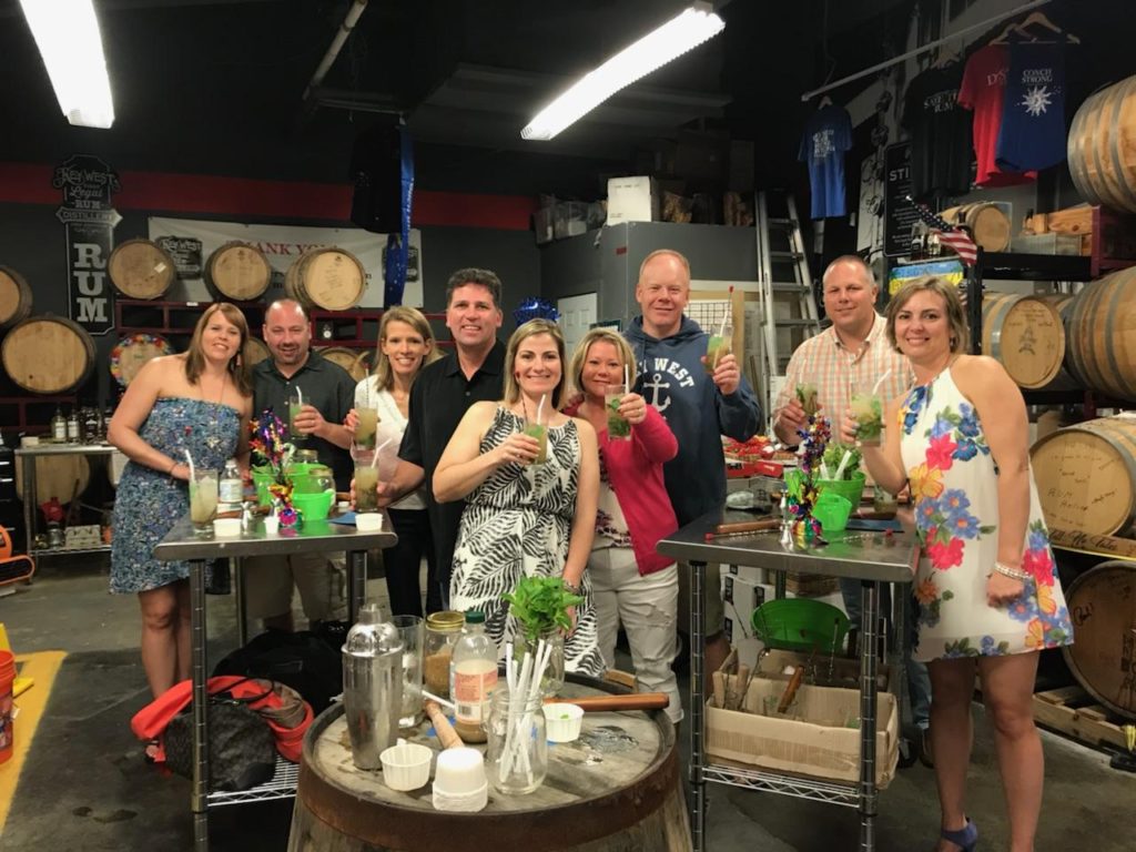 image of friends drinking fresh mojitos that the just learned how to make
