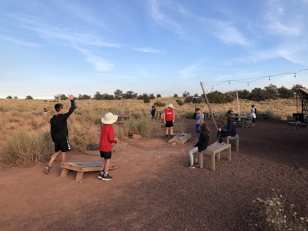 Playing cornhole at Under Canvas Grand Canyon