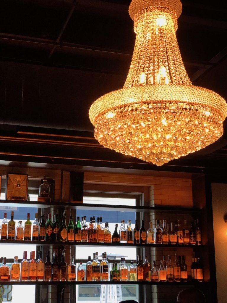 Beautiful chandelier at the bar Sundry and Vice at the Bottleworks hotel